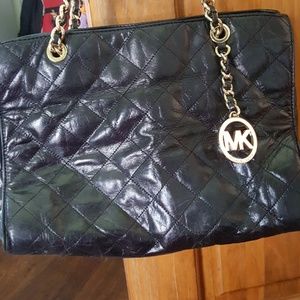 Black and gold leather used Michael Kors bag